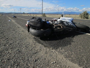 Saddlebag entangled with rear wheel.